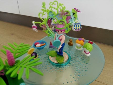 A mermaid gets ready in the beauty parlour.