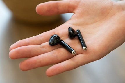 The earbuds look like the AirPods 2.