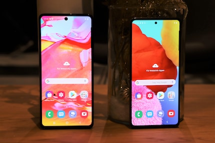 Different sized displays with a hole for the front camera.