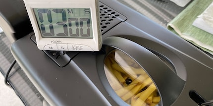 The timer is set and the fries are ready for their first dip in the fat.