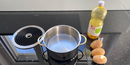Boiling water and table vinegar should spice up my fries.