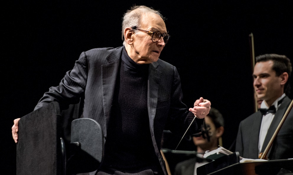 Ennio Morricone in 2013 during an orchestral performance of his film music.