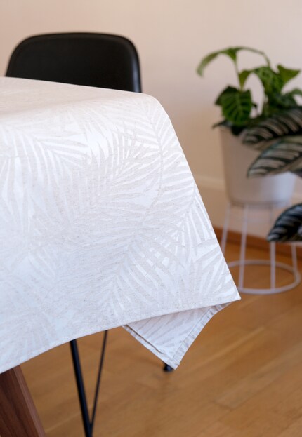The flowery tablecloth is made from a blended fabric.