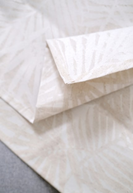 It contains polyester, cotton and linen and is coated with acrylic.