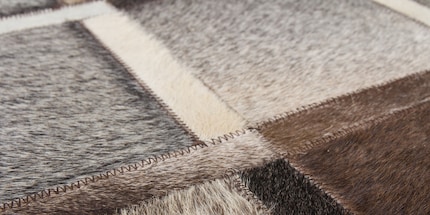 Leather is an exclusive but delicate carpet material.