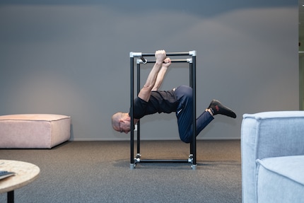 Rotate slowly and hold it, then turn back to your starting position.