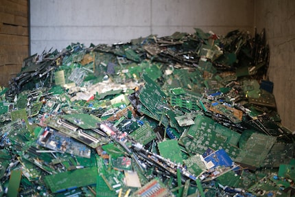 Mountains of worn out printed circuit boards wait to be transported.