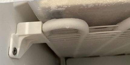 If too much ice forms on the cooling coils, you need to defrost the freezer.