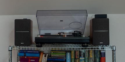 The metal grid and airy space underneath it make the Edifier speakers sound better.