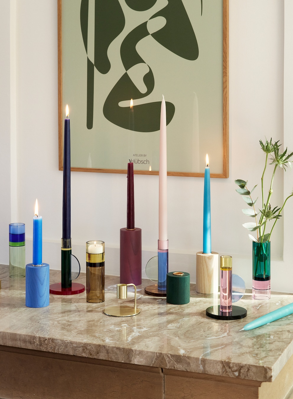 Candles in all different colours are the real mood makers. Image: Hübsch