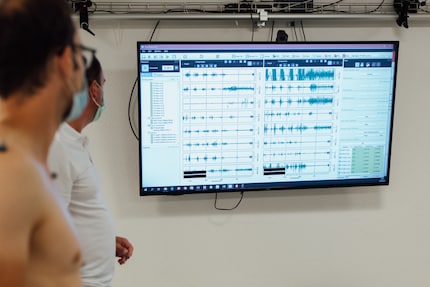 The EMG sensors record muscle activity.