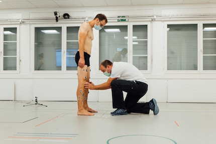 Mark Huybrechts perfects the position of the markers that will turn me into a catwalk model.