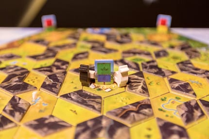 The game begins in the white village in the middle of the board.