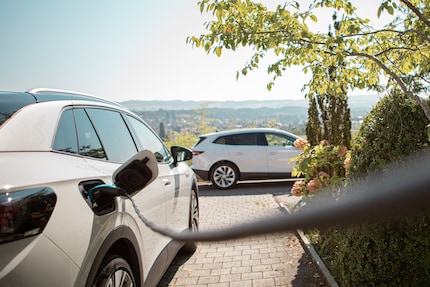 Charging with a view: Hans Fischer charges up his car at home using solar power from his own roof.