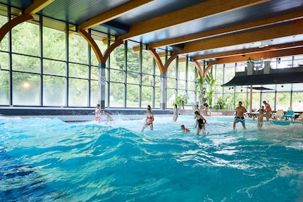 The wave pool is filled with big waves at the full and half hour.