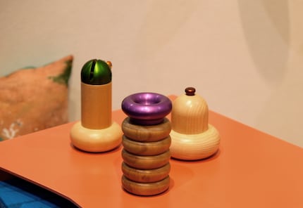 Screaming salt shaker: a gaudy aluminium head sits on the wooden body.