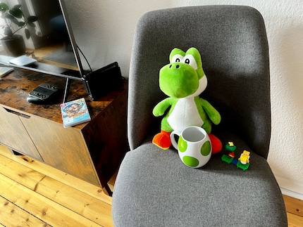 Mein Nintendo-Merch besteht aktuell aus einem Plüsch-Yoshi, einem Lego-Yoshi und einer Yoshi-Tasse. So ein Affe à la Donkey Kong würde die homogene Herde aufmischen.