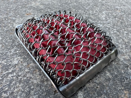 The brush head with wire mesh and silicone insert.