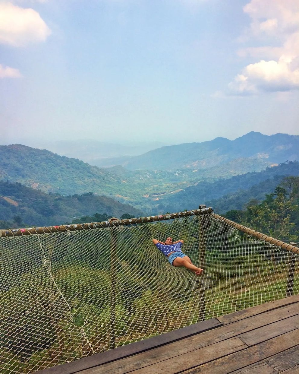 From the giant hammock, you can enjoy the breathtaking view of the mountains and a dreamy valley below the hostel «Casa Elemento».