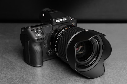 You can program the three buttons above the shutter release and the two on the front yourself. 