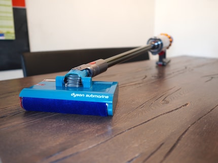 The Submarine head is attached to a Dyson, which of course can also vacuum normally.
