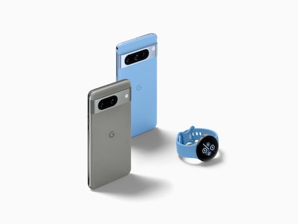 The Pixel 8 in grey and the 8 Pro in blue together with the Pixel Watch 2.