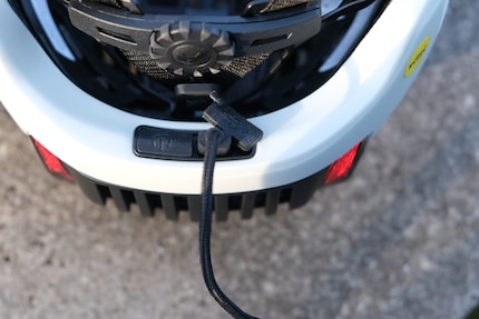 The charging port and power button are located at the rear edge of the Brighton.