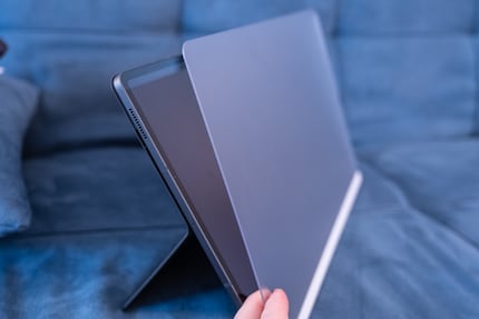 The thick, matt screen cover is magnetically attached to the tablet.