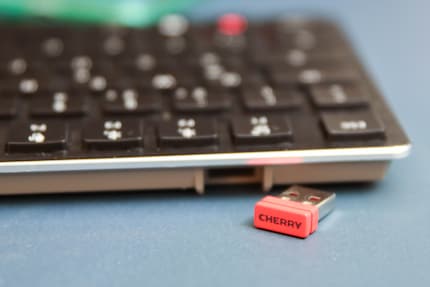 The wireless adapter fits into the keyboard when not in use.
