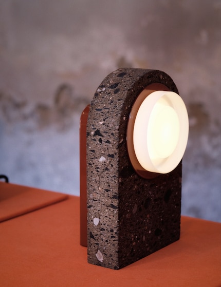 The Ambra series combines antique stone with aluminium.