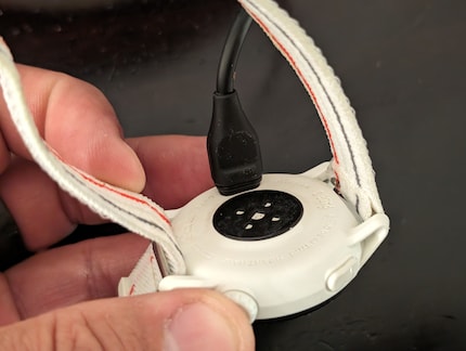 I have to plug the charging cable into the back, not an elegant solution.