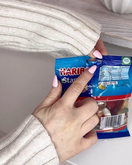 The tab in the hole on the Haribo bag is obviously not just for hanging up.