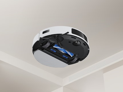 The robot has a vibrating mop plate and a brush that is designed to minimise hair entanglement.