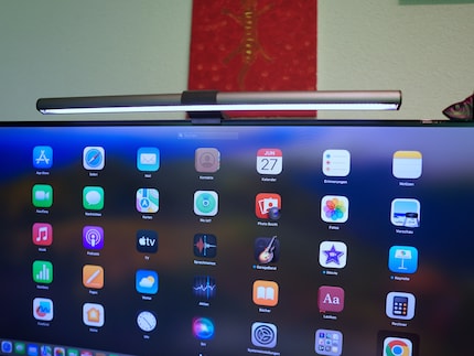 The screenbar illuminates the desk alone.
