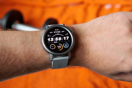 The CMF Watch Pro with rounded bezel.
