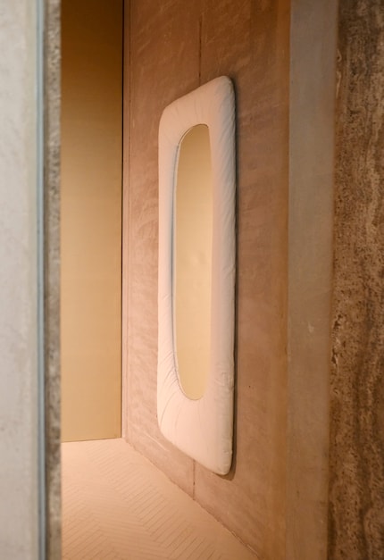 Stellar by Faye Toogood for Tacchini, wall mirror with wooden frame, covered with natural and paper fibres, 2024.