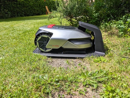 The lawnmower charges up in the charging station when necessary.