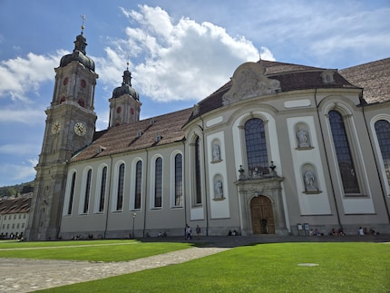The monastery in St. Gallen, with overly green meadows.