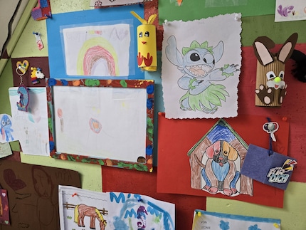 A small unlit room with my niece’s artwork – and yet the colours shine.
