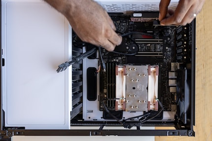 My hard disks are located behind the white cover on the left-hand side.