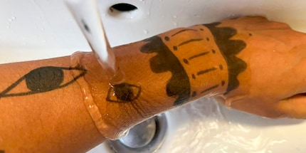 The water washes most of the ink off straight away.