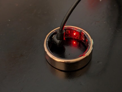 The ring’s charged with a cable that has to be plugged in inside.