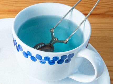 The flowers turn the tea a deep blue.
