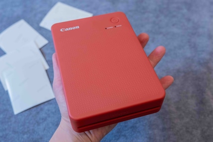 The Canon Selphy QX20 in bright red.