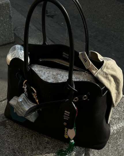 Caps really cut it as a bag accessory.