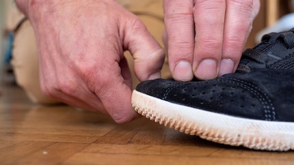 Use both hands to make sure the toes are stretched.
