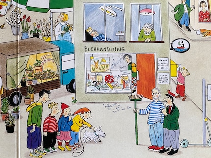 Susanne stands in Armin's bookshop, Armin in front of it with a broom in his hand.