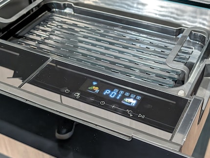 Operation is via a touch panel inside the drawer.
